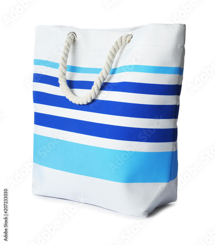 Beautiful female bag on white background. Beach object