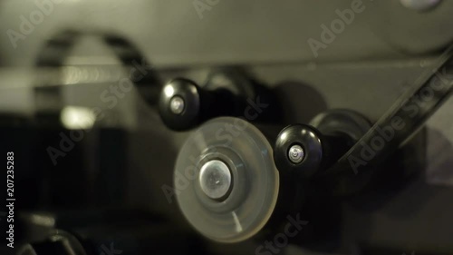 Wallpaper Mural Old film projector playing in the night. Close-up of a reel with a film Torontodigital.ca