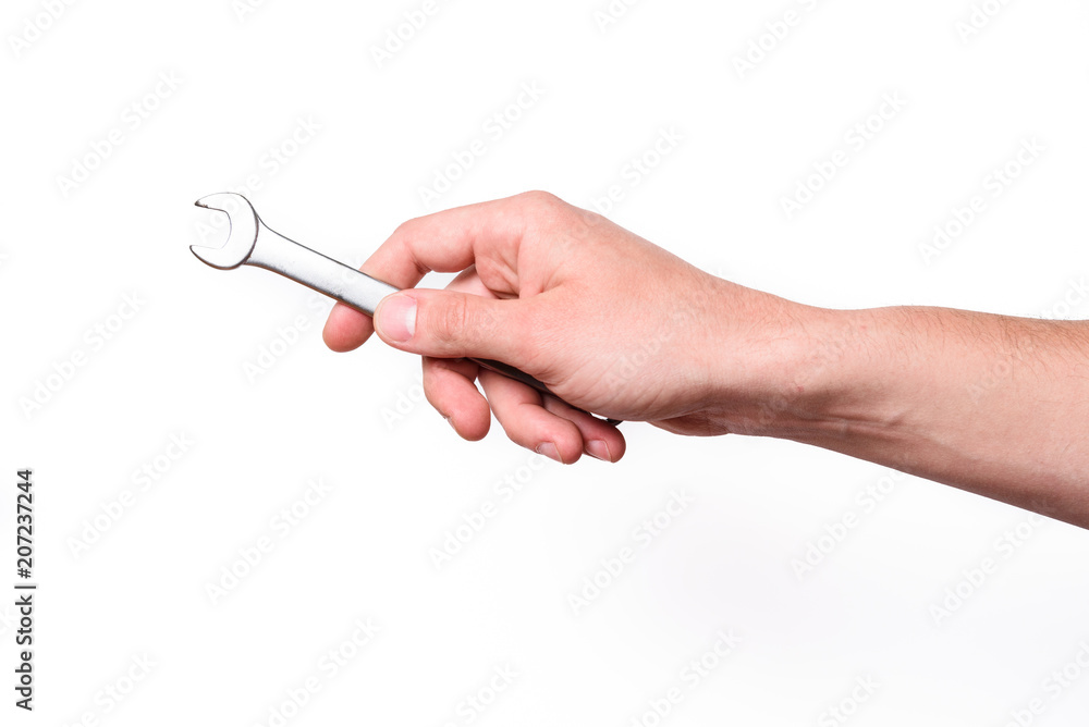 Hand with wrench on white background isolated. Hand with wrench on white background isolated.