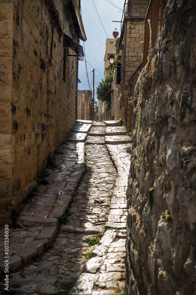 Ancient streets in traditional town Deir el Qamar in vertical position, Lebanon