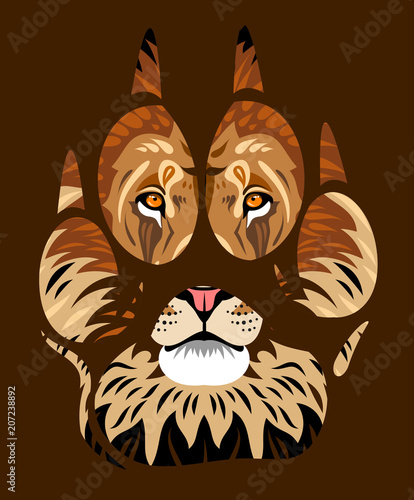 Fototapeta Naklejka Na Ścianę i Meble -  muzzle of a lion in a paw print