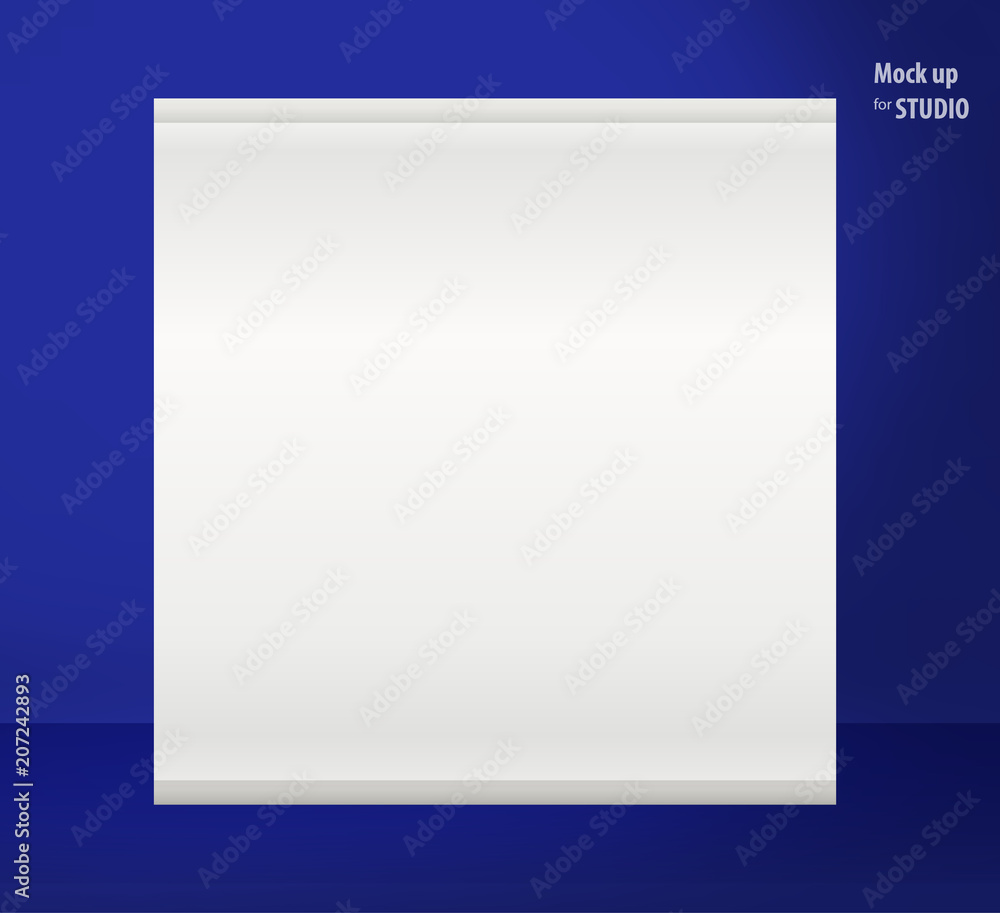 White sheet for photos hanging on the dark blue wall in a room studios Template mock up for display of product or your content. Business background.