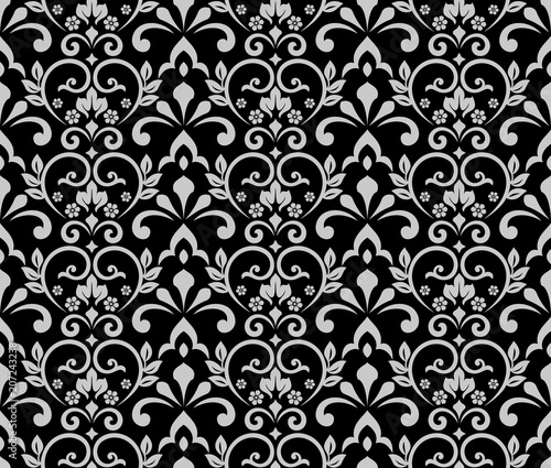 Wallpaper in the style of Baroque. A seamless vector background. Black and grey floral ornament. Graphic pattern for fabric, wallpaper, packaging. Ornate Damask flower ornament