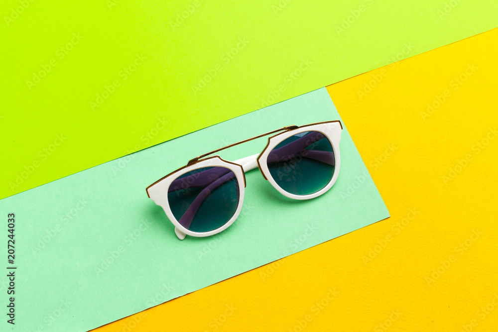 Female sunglasses on a colorful vibrant background Female sunglasses on a colorful vibrant background