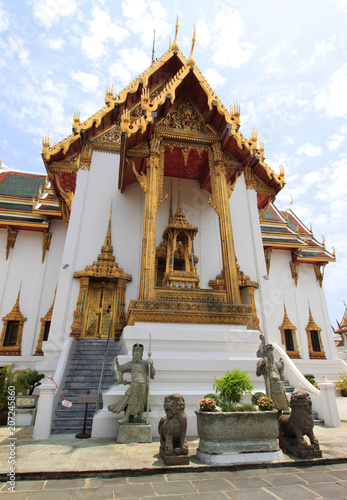 Wallpaper Mural Exterior view of Temple of the Emerald Buddha, buidling of Wat Phra Kaew, Grand - Royal Palace, Bangkok (Krung Thep), Thailand, Asia. Colorful rooftops, golden ornaments and statues. Torontodigital.ca
