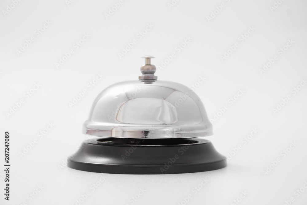 A desk call for the hotel reception. female hand A desk call for the hotel reception. female hand