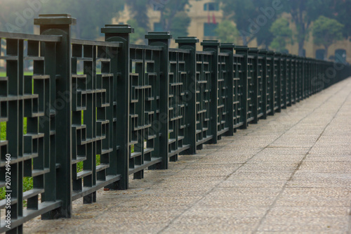 Steel fence in China style along the pathway at Ba Dinh Square, Hanoi, Vietnam