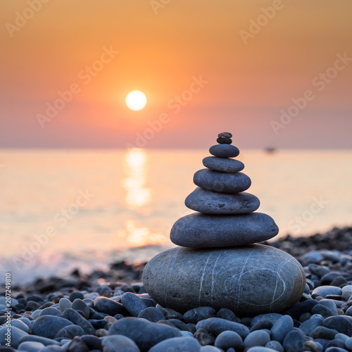 Pyramid of stones on sea coast