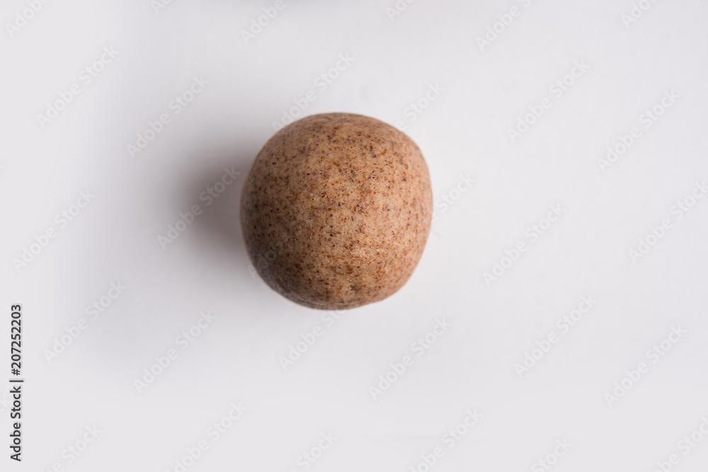 Nachni laddu or Ragi laddoo or balls made using finger millet, sugar and ghee. It's a healthy food from India. Served in a bowl or plate over moody background. Selective focus Nachni laddu or Ragi laddoo or balls made using finger millet, sugar and ghee. It's a healthy food from India. Served in a bowl or plate over moody background. Selective focus