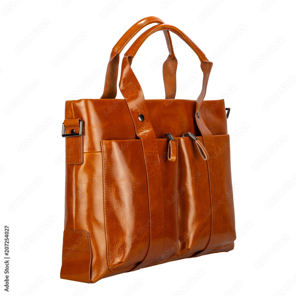 Fashionable classic bag of solid smooth patent leather natural light brown color side view, isolated on white Fashionable classic bag of solid smooth patent leather natural light brown color side view, isolated on white