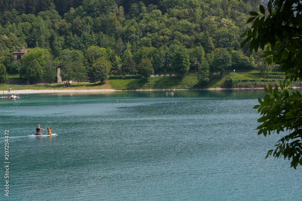 26 may 2018, ledro lake in trentino, little town of Ledro tourist point of sportive people. Landmark for ancient palafitte from bronze age in Ledro Valley 26 may 2018, ledro lake in trentino, little town of Ledro tourist point of sportive people. Landmark for ancient palafitte from bronze age in Ledro Valley