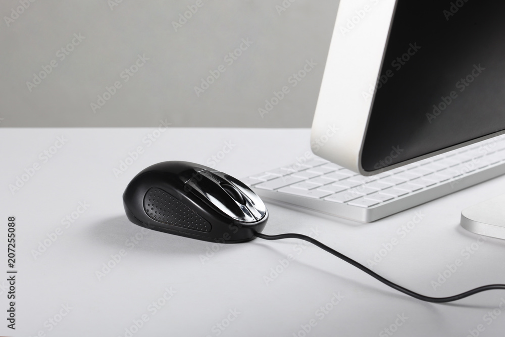 computer, mouse and keyboard on a white desk with copy space computer, mouse and keyboard on a white desk with copy space