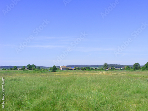 Old village  summer landscape. Rural building in Belarus