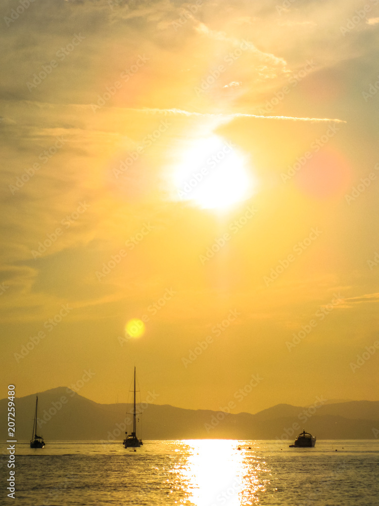 Scenic harbor of Sestri Levante at sunset with its famous Bay of Silence and its boats. Province of Genoa in Liguria, Italy.vertical Scenic harbor of Sestri Levante at sunset with its famous Bay of Silence and its boats. Province of Genoa in Liguria, Italy.vertical