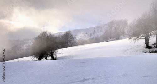 beautiful landscape in winter snowy mountain under cloudy sky