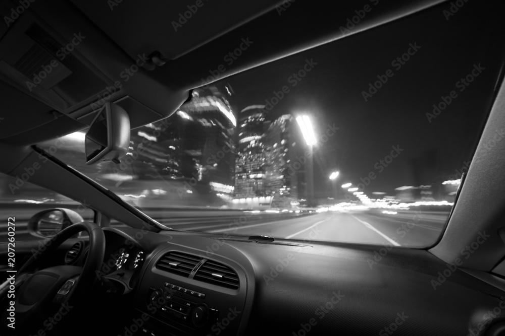 Car speed drive on the road in night city