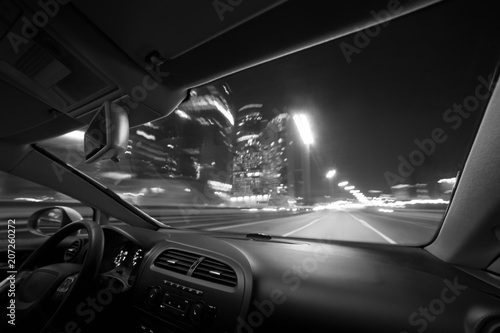 Car speed drive on the road in night city