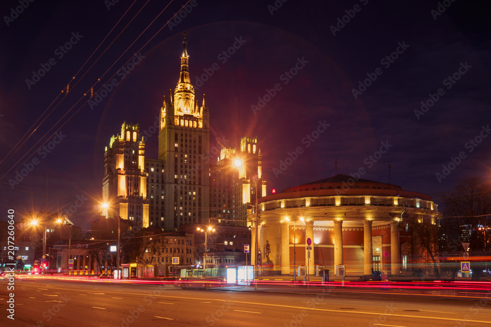 The light trails on the modern building background in Moscow, Russia