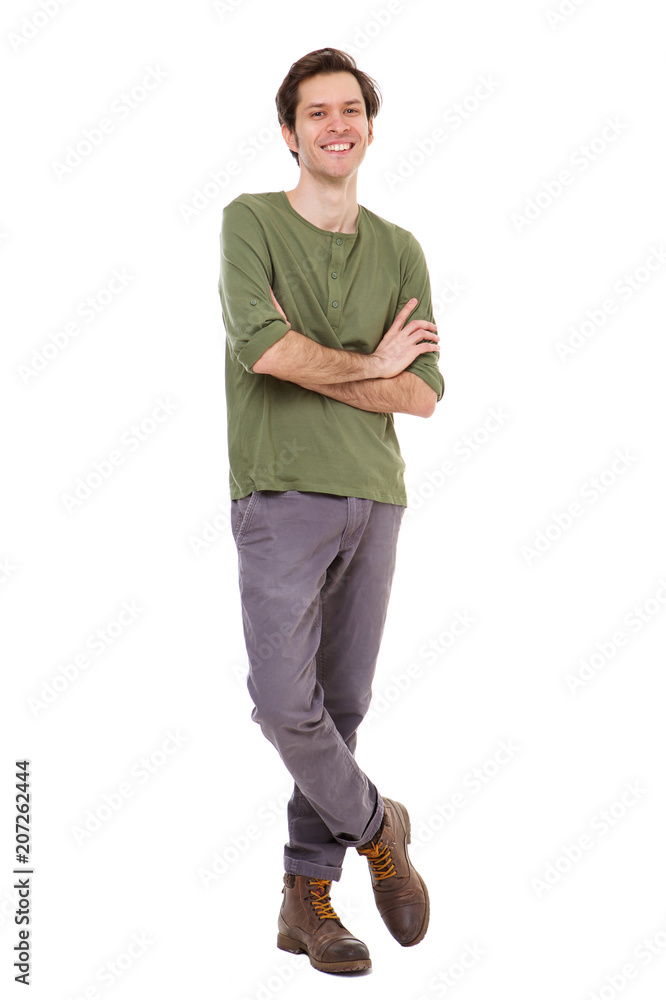 Full length casual man smiling and standing with arms crossed Full length casual man smiling and standing with arms crossed