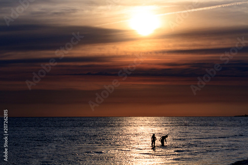 Couple in the sea, time before the sunset © Nobilior
