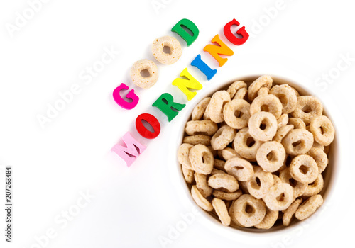 healthy cereal rings on white background. Good morning. A healthy, healthy breakfast. Dry muesli. © stas_malyarevsky