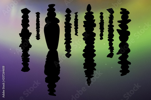 Pyramids of stones at night. Vector illustration silhouette of balancing pebble reflected in water. Northern lights in starry sky. Colorful aurora borealis