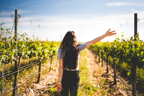 Anonymous woman walking in winery photo
