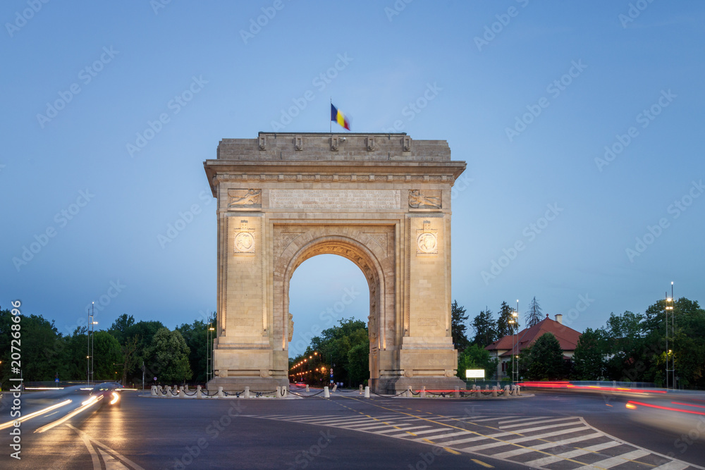 Bucharest, The Triumphal Arch (Arcul de Triumf) at dusk