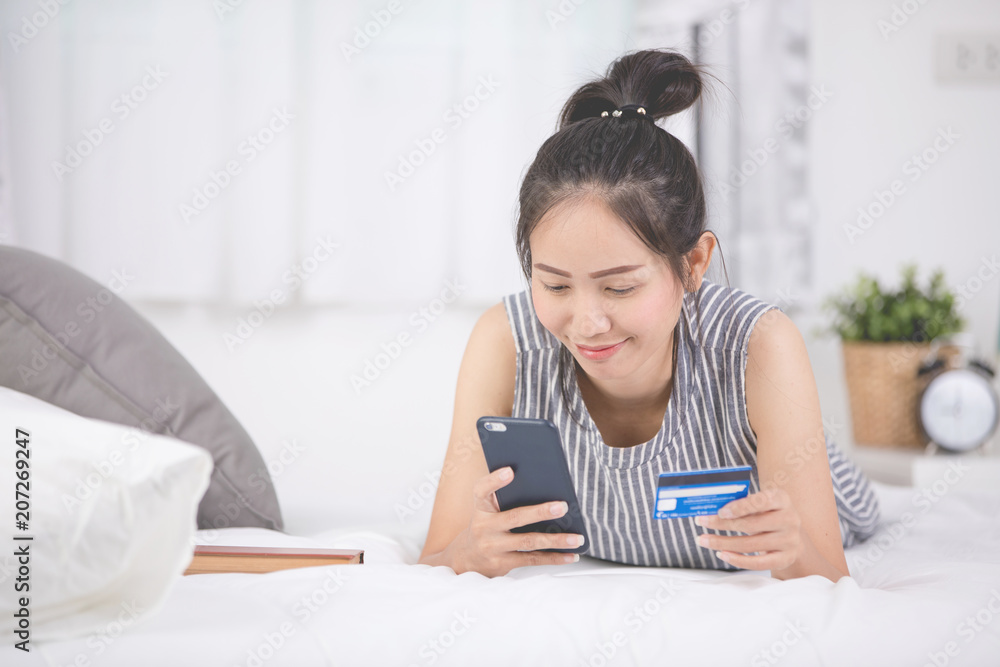 Young beautiful woman with credit card and smart phone Young beautiful woman with credit card and smart phone