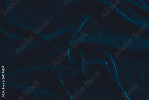 Luxurious dark blue velvet fabric background photo
