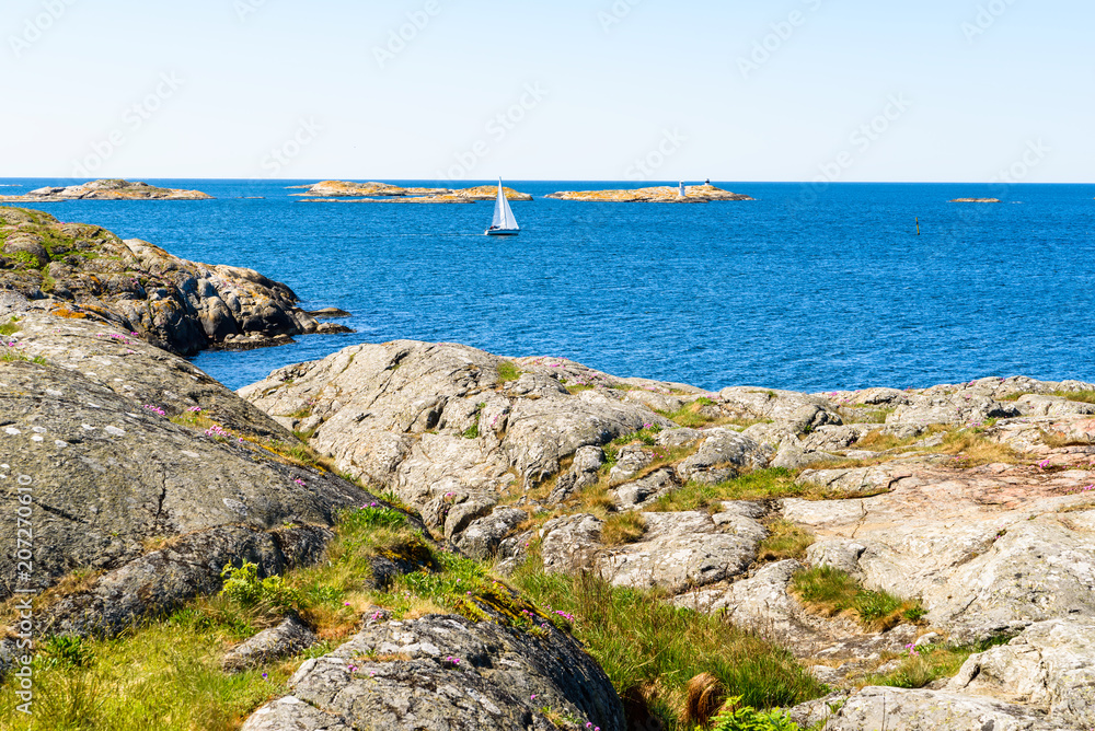 Sailing among islands and islets in rocky coastal waters. Sailing among islands and islets in rocky coastal waters.
