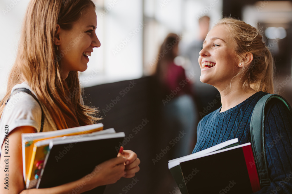 College students chatting in the hallway College students chatting in the hallway
