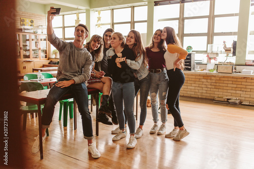 Students in classroom taking selfie