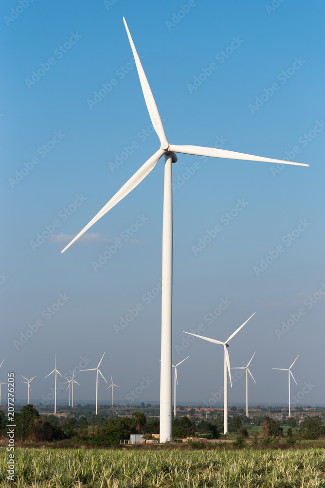 Wind turbine farm and agricultural fields. Energy Production with clean and Renewable Energy Wind turbine farm and agricultural fields. Energy Production with clean and Renewable Energy