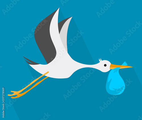 Stork. Stork flying in the sky in the beak of the bag.