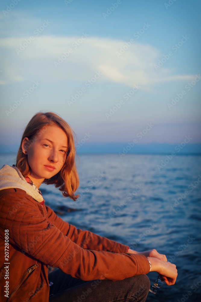 Portrait of young beautiful lady admiring the summer landscape o Portrait of young beautiful lady admiring the summer landscape o