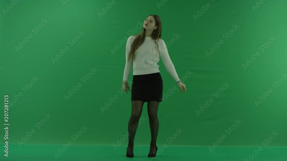 young woman stands straight and moves on green screen young woman stands straight and moves on green screen
