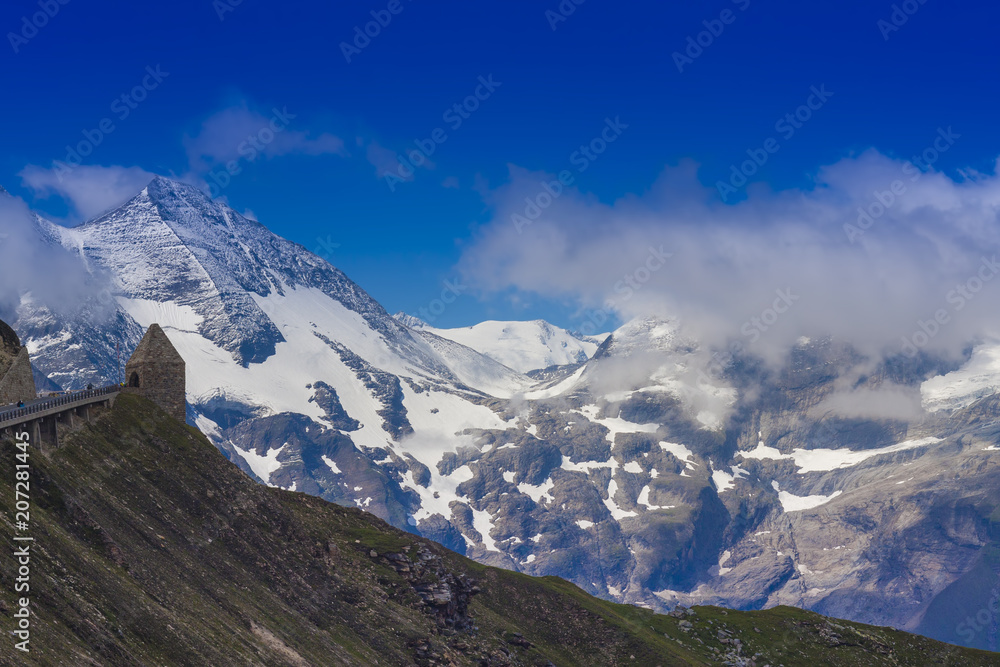 alpine mountain peak with blue sky background. Grossglockner pass, Austria