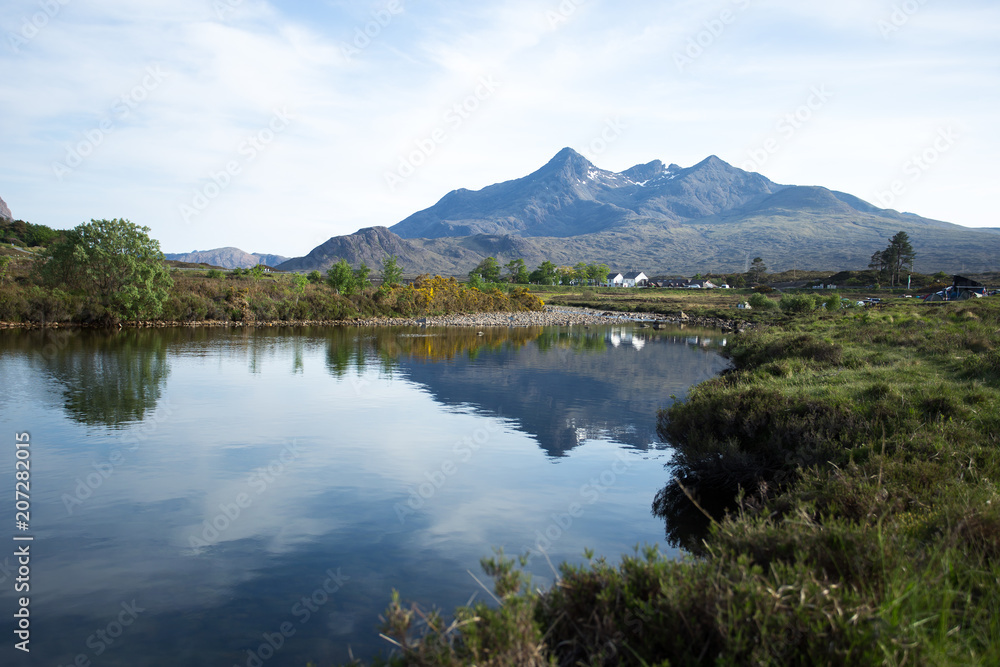 Cuillin mountains with lake reflection in Isle of Skye, Scotland