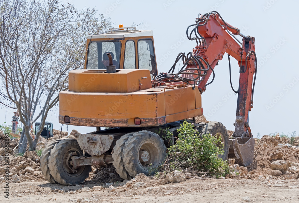 modern excavator performs excavation work