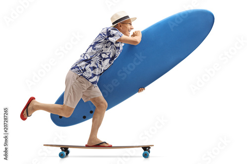 Elderly tourist with a surfboard riding a longboard