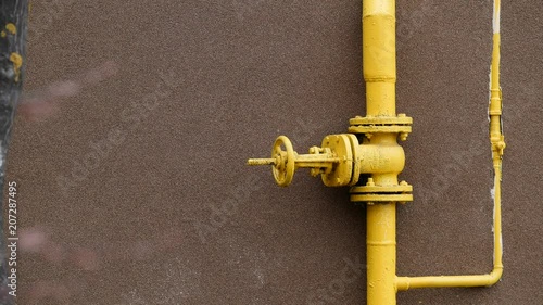 gas faucet on the background of the wall