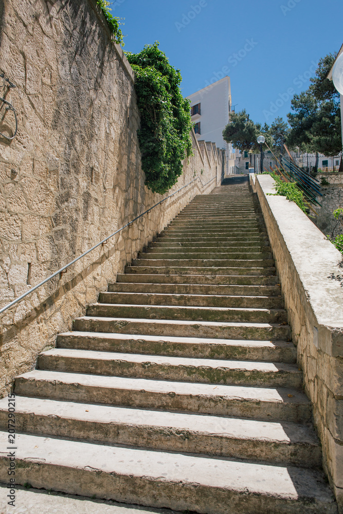 Stone stairs Vieste apulia old wtite city in Italy