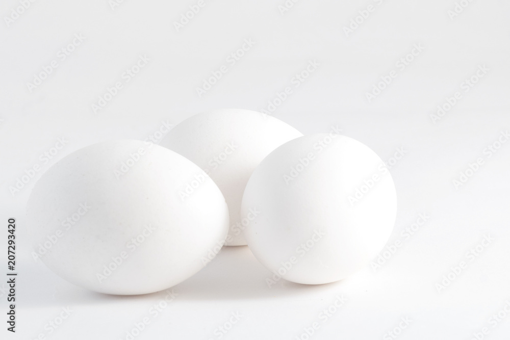 Three white eggs isolated on white background Three white eggs isolated on white background