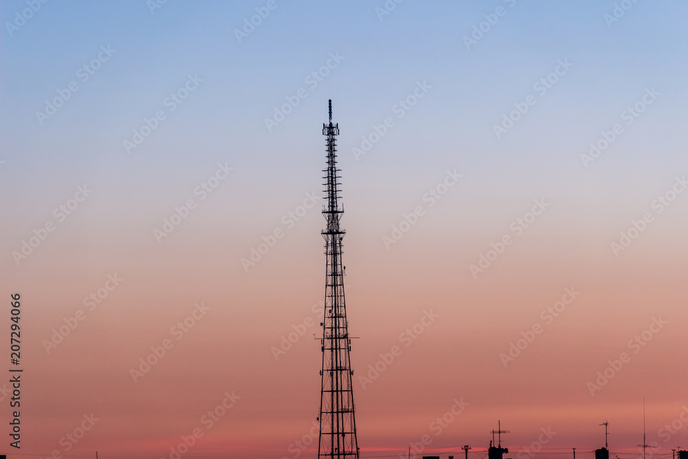 TV tower in the background of the city and sunset