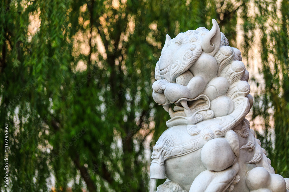 Lion stone carving in the temple of the chinese.