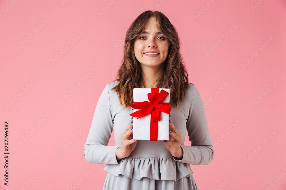 Cute young pretty woman holding surprise gift present box. Cute young pretty woman holding surprise gift present box.