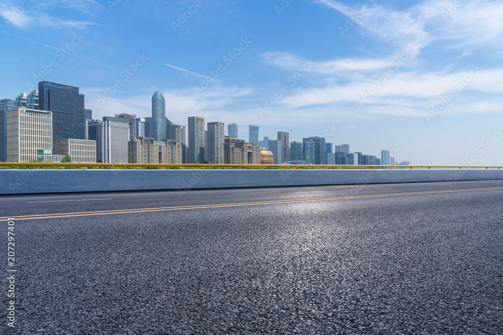 city skyline with empty asphalt road in urban city skyline with empty asphalt road in urban