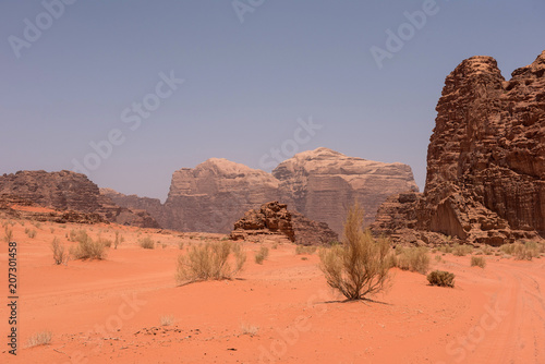 Red sand dunes and sandstone cliffs