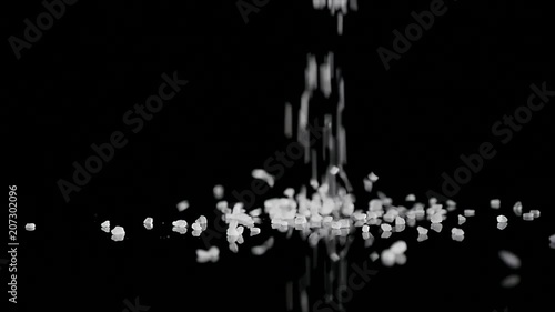 coarse sea salt crystal falling on black background